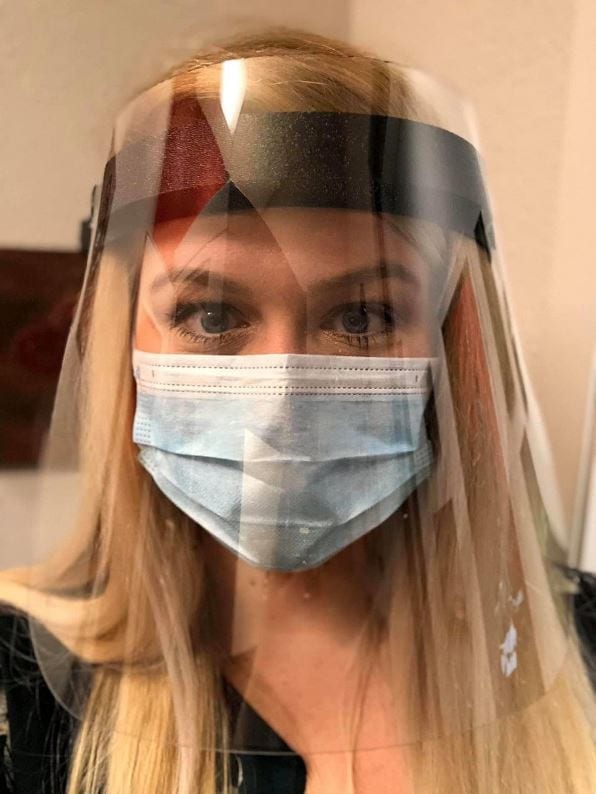 Dr. Emily McMahan wearing face protection