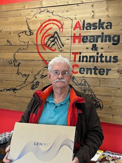 Elder Patient of Alaska Hearing & Tinnitus Center with Lenire Device Package