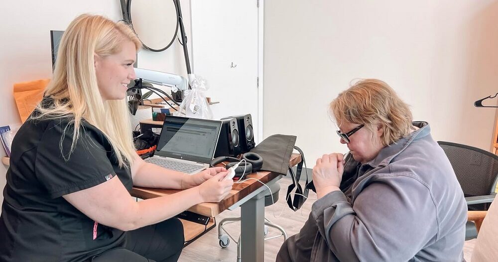 Dr. Emily E McMahan with Patient discussing the Lenire Device