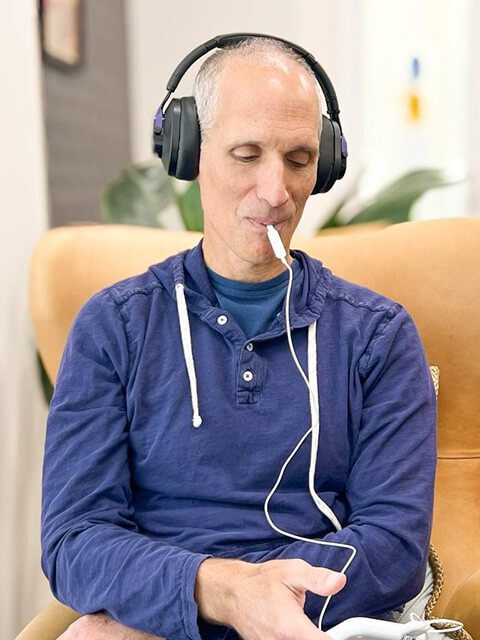 A Male Patient Using the Lenire Device