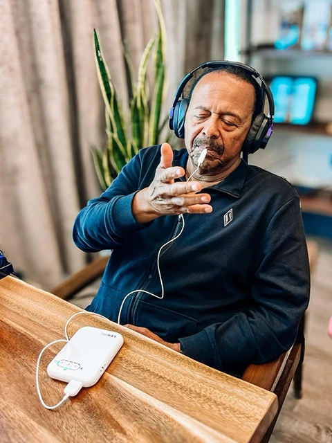 A Male Patient Testing the Lenire Device At Alaska Hearing & Tinnitus Center