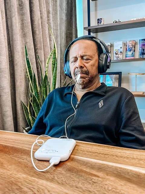 A Male Patient Testing the Lenire Device At Alaska Hearing & Tinnitus Center