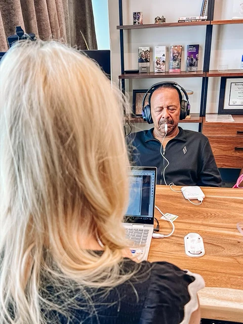 Dr. Emily McMahan With A Male Patient During Lenire Tinnitus Treatment