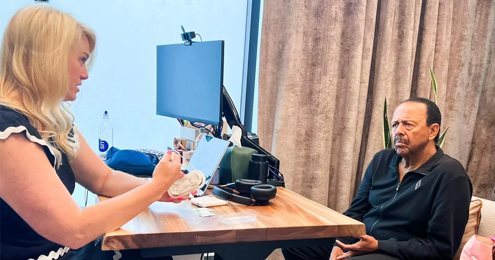 Dr. Emily McMahan Discussing Lenre Tinnitus Treatment with A Patient During Appointment